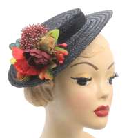 Black flat straw hat with autumnal corsage flowers for changing